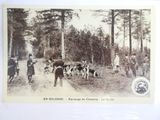 an old photo of a group of people and dogs