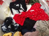 a basket full of clothes that is sitting on a table