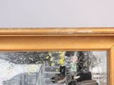 a picture of a painting of a motorcycle in a gold frame