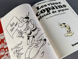 an open book with a drawing of a man on a skateboard