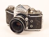a black and white photo of a camera on a white background