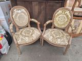pair of antique chairs with upholstered upholstered cushions