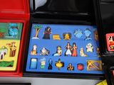 a lot of different toys in a box on the table