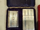 a box with a razor, razor blade, razor blade and a razor blade in it