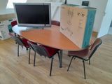 a table with a laptop and a box on it