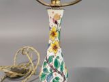 a lamp that is sitting on a table next to a lamp