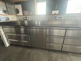 a stainless steel counter top in a kitchen with a sink
