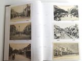 an open book with pictures of old buildings on the pages