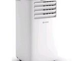 a white air conditioner sitting on top of a white table