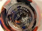 a close up of a glass of water on a table