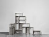 an image of a stack of wooden crates in a white room