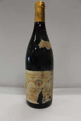a bottle of wine that is sitting on a table