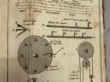 an old book with a drawing of a machine on it