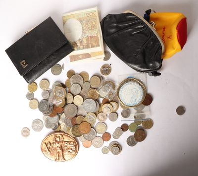 a lot of coins and a purse on the table
