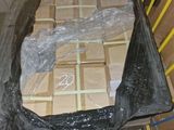 a large box of boxes on a pallet in a warehouse