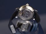 a close up of a watch on display on a table