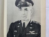 an old black and white photo of a man in a military uniform
