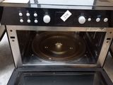 a black and silver oven with a black stove top