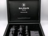 a black box with three bottles of balmain perfume in it