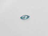 a blue topazte gems on a white surface