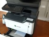 a printer that is sitting on top of a desk