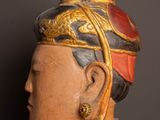 a close up of a statue of a man wearing a hat
