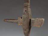 an image of a wooden sculpture of a plane on a stand