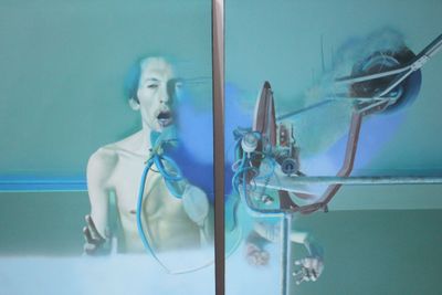 a picture of a man that is in a bath room