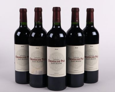 six bottles of red wine are lined up in a row