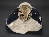 an image of a helmet with a hat on it sitting on top of a table