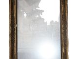 a picture of a mirror hanging on the wall