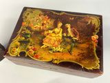 a box with a painting on it sitting on a table