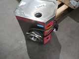 a machine that is sitting on a pallet in a warehouse