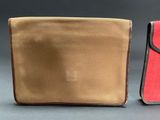 an image of a pair of wallets sitting next to each other