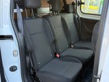 two seats in the back of a van with the door open