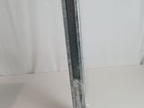 a metal pole that is standing on a white surface