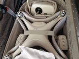 a person opening a suitcase with a camera inside of it