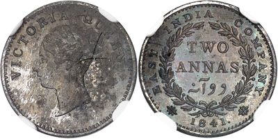 a close up of a coin on a white surface