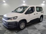 the white van is parked on a checkered tile floor