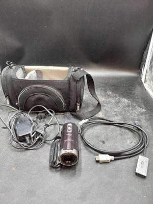 a camera and other electronics sitting on the floor