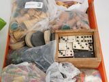 a wooden box filled with assorted items on a table