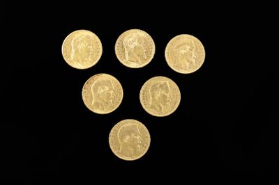 six gold coins are arranged in a triangle on a black background