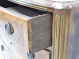 a close up of a dresser with a drawer in it