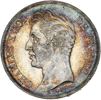 un gros plan d'une vieille pièce de monnaie sur laquelle figure le visage d'un homme