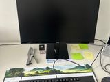 a keyboard, mouse, and monitor on a desk