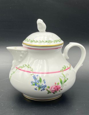 an image of a white tea pot with a bird on it