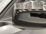 a close up of a car ' s side view mirror with a measuring tape on it