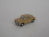 petite voiture jaune sur une surface blanche