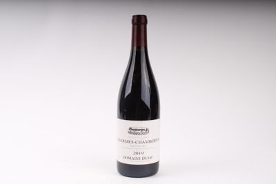 a bottle of wine that is sitting on a table