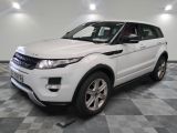 a picture of a white land rover parked in a garage